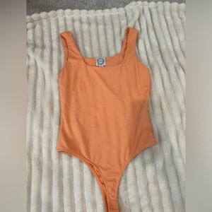 Blue rain bodysuit peach